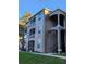 Exterior of three-story building with balconies and landscaping at 7135 Yacht Basin Ave # 237, Orlando, FL 32835