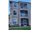 Exterior of three-story building with balconies at 7135 Yacht Basin Ave # 237, Orlando, FL 32835