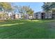 Expansive grassy area with apartment buildings in the background at 7135 Yacht Basin Ave # 237, Orlando, FL 32835