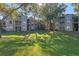 Expansive green lawn in front of apartment buildings at 7135 Yacht Basin Ave # 237, Orlando, FL 32835