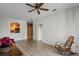 Living room with hardwood floors and kitchen view at 7135 Yacht Basin Ave # 237, Orlando, FL 32835