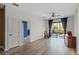 Living room with hardwood floors and sliding doors at 7135 Yacht Basin Ave # 237, Orlando, FL 32835