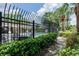 Community pool area with lounge chairs, umbrellas and lush landscaping at 7135 Yacht Basin Ave # 237, Orlando, FL 32835