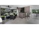 Covered patio with seating and a wet bar near the pool at 7135 Yacht Basin Ave # 237, Orlando, FL 32835
