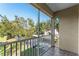 Screened balcony overlooking trees and parking lot at 7135 Yacht Basin Ave # 237, Orlando, FL 32835