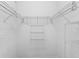 Empty walk-in closet with wire shelving and hanging rods at 7135 Yacht Basin Ave # 237, Orlando, FL 32835