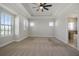 Primary bedroom with carpet flooring and access to bathroom at 1379 Kiawah St, Celebration, FL 34747