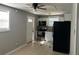 Cozy kitchen with white cabinets and black appliances at 221 N Julia Ave, Deland, FL 32720