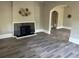Living room featuring a fireplace and hardwood floors at 221 N Julia Ave, Deland, FL 32720