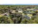 Aerial view of a residential neighborhood showcasing the property's surroundings and nearby amenities at 2441 Derby Dr, Deltona, FL 32738
