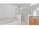 Bathroom boasts a shower, bathtub, and granite vanity at 2441 Derby Dr, Deltona, FL 32738
