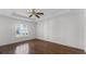 Spacious bedroom featuring wood floors and a large window at 2441 Derby Dr, Deltona, FL 32738