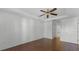 Spacious bedroom with wood floors and bathroom access at 2441 Derby Dr, Deltona, FL 32738