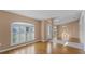 Bright dining room featuring hardwood floors and window with shutters at 2441 Derby Dr, Deltona, FL 32738