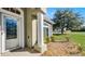 Front entrance with a white door and sidelights at 2441 Derby Dr, Deltona, FL 32738