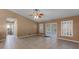 Gathering room with tile floors, sliding doors, and ceiling fan at 2441 Derby Dr, Deltona, FL 32738