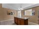 Kitchen island with granite countertop and wood cabinets at 2441 Derby Dr, Deltona, FL 32738