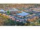 Aerial view of a home nestled in a vibrant community near a lake at 2609 Mead Ave, St Cloud, FL 34771