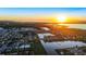 Aerial view of community near lake at sunset at 2609 Mead Ave, St Cloud, FL 34771