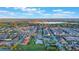 Aerial view of a community with a pool, homes, and green spaces at 2609 Mead Ave, St Cloud, FL 34771