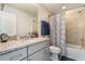 Bathroom with granite vanity and shower at 2609 Mead Ave, St Cloud, FL 34771