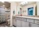 Bathroom with granite countertop, double sinks and shower/tub at 2609 Mead Ave, St Cloud, FL 34771