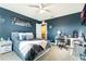 Spacious bedroom with a desk and large TV at 2609 Mead Ave, St Cloud, FL 34771