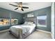 Bedroom with window, ceiling fan and plush bed at 2609 Mead Ave, Saint Cloud, FL 34771