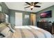 Bedroom with dresser, ceiling fan and large bed at 2609 Mead Ave, St Cloud, FL 34771