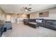 Bonus room featuring a large sectional sofa and ceiling fan at 2609 Mead Ave, St Cloud, FL 34771