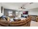 Spacious bonus room with comfortable seating and large TV at 2609 Mead Ave, St Cloud, FL 34771