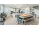 Kitchen with large island, dining table, and adjacent workspace at 2609 Mead Ave, St Cloud, FL 34771