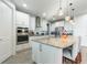 Modern kitchen with white cabinets, granite countertops and stainless steel appliances at 2609 Mead Ave, St Cloud, FL 34771