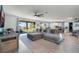 Large living room with sectional sofa, sliding glass doors and open floor plan at 2609 Mead Ave, St Cloud, FL 34771