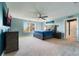 Main bedroom with king-size bed and water views at 2609 Mead Ave, St Cloud, FL 34771