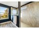 Large walk-in shower with tile surround and window at 2609 Mead Ave, St Cloud, FL 34771