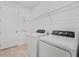 Laundry room with washer, dryer, and overhead shelving at 2740 Sweet Acacia Dr, Clermont, FL 34711