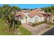 Aerial view of villa, showcasing the roofline and landscaping at 404 Brunello Dr, Davenport, FL 33897
