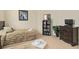 Twin bedroom with two beds, dresser, and bookcase at 404 Brunello Dr, Davenport, FL 33897