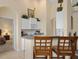 Small kitchen with white cabinets, microwave and cooktop at 404 Brunello Dr, Davenport, FL 33897