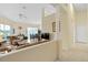Open living room with high ceilings, neutral colors and tiled floor at 404 Brunello Dr, Davenport, FL 33897