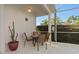 Screened patio with table and chairs, great for outdoor dining at 404 Brunello Dr, Davenport, FL 33897