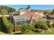 Private screened pool area in backyard with lush landscaping at 404 Brunello Dr, Davenport, FL 33897