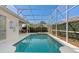 Inviting screened pool and spa with patio furniture at 404 Brunello Dr, Davenport, FL 33897