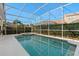 Screened pool and spa with plenty of space for lounging at 404 Brunello Dr, Davenport, FL 33897