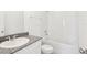 Clean bathroom with granite countertop and bathtub at 520 Kennedy Dr, Lake Alfred, FL 33850