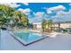 Community swimming pool with lounge chairs and surrounding landscaping at 525 Conway Rd # 92, Orlando, FL 32807