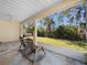 Relaxing screened porch overlooking the backyard at 610 Aeolian Dr, New Smyrna Beach, FL 32168