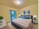 Main bedroom with sliding glass doors leading to backyard at 8227 Vineland Oaks Blvd, Orlando, FL 32835