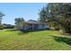 Large backyard with lush green grass and a view of the house at 1178 Black Walnut Ct, Winter Springs, FL 32708